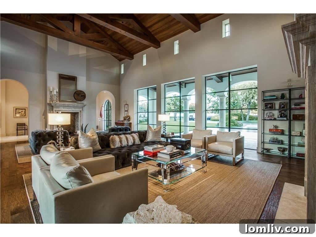 Spacious living room at 10731 Bridge Hollow Court with elegant timbered ceiling and abundant natural light