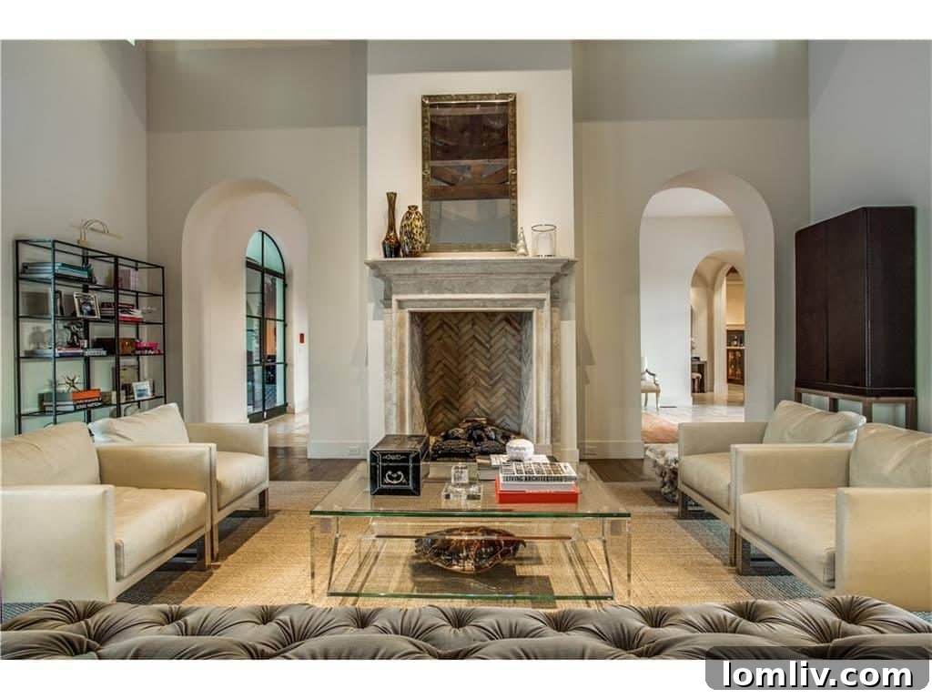 Detailed view of a carved limestone fireplace in the main living room, showcasing intricate craftsmanship
