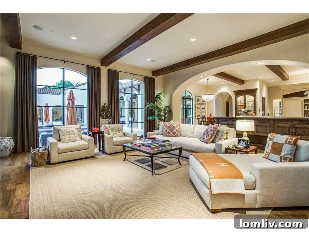 Modern gourmet kitchen featuring Sub-Zero and Wolf appliances, integrated with a bright breakfast nook