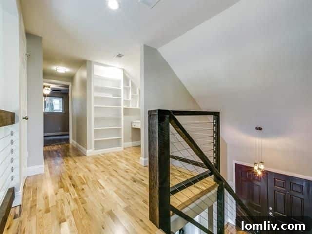 Upper entry and catwalk area cleverly utilizing the roofline for nooks and storage solutions