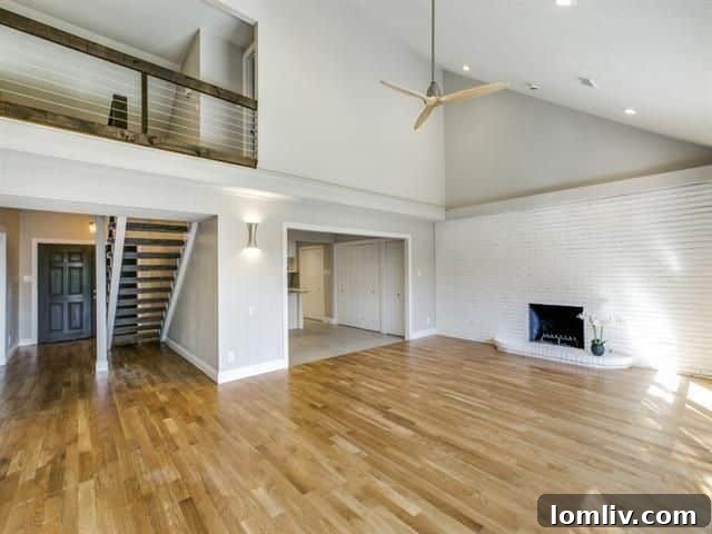 Open concept view from living room towards kitchen and catwalk in 3822 Treeline Drive