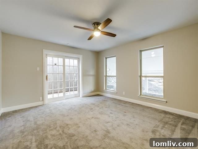 Spacious master bedroom with French doors leading to a private patio at 3822 Treeline Drive