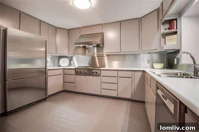 Sleek Kitchen with Thermador Appliances and Built-in Refrigerator