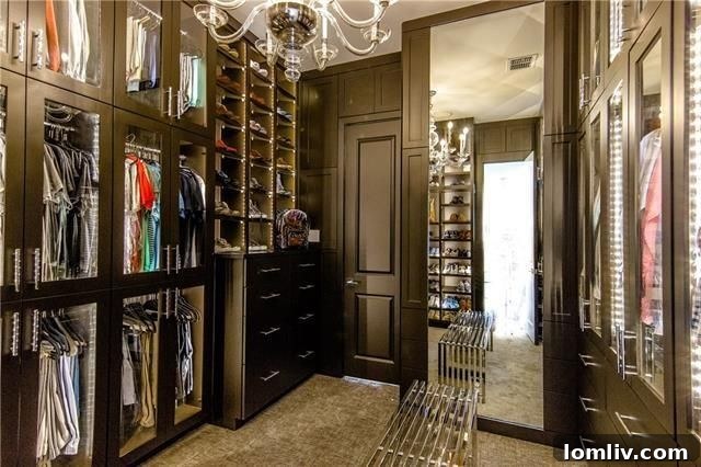 Custom Master Closet with Extensive Shoe Storage and Chandelier