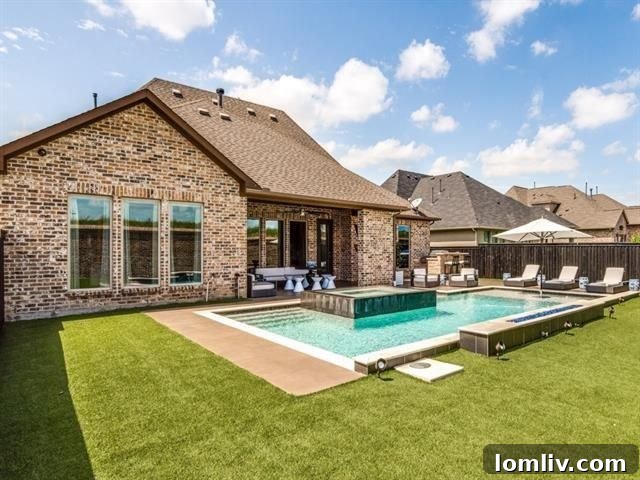 Rear View of the Luxurious Home with Backyard Amenities