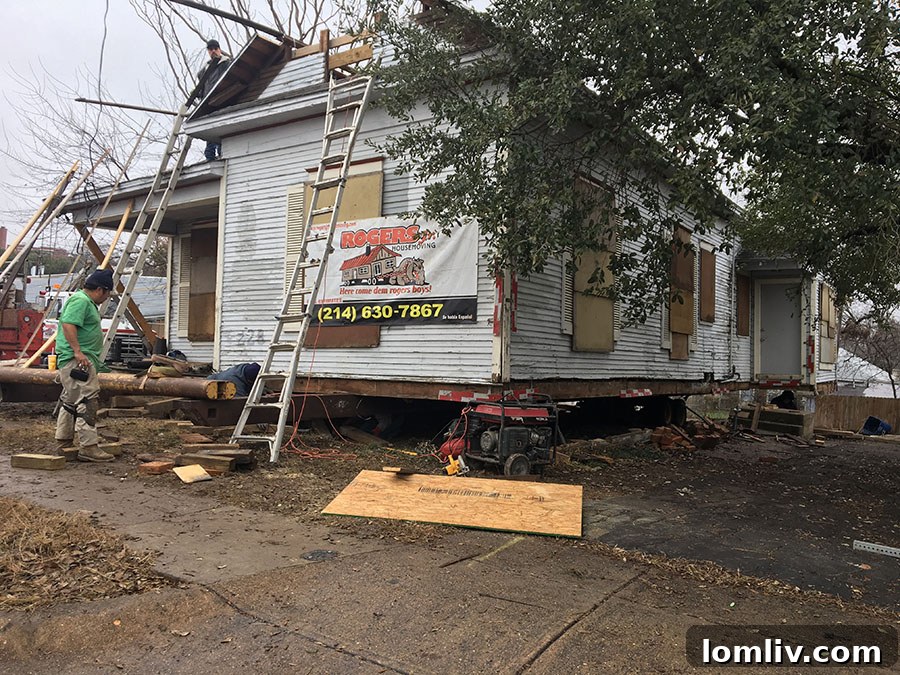 Rogers Jr. House Moving team carefully preparing the historic home for relocation.