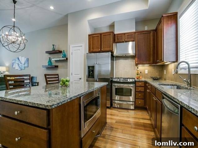 Gourmet Kitchen with Stainless Steel Appliances and Quartz Countertops