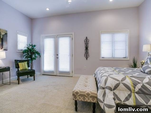 Spacious Master Bedroom with French Doors in Uptown Dallas Home