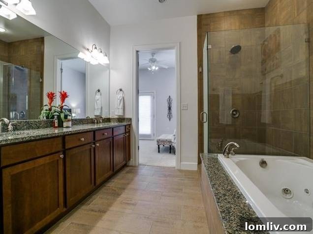 Luxurious Master Bathroom with Soaking Tub and Frameless Shower
