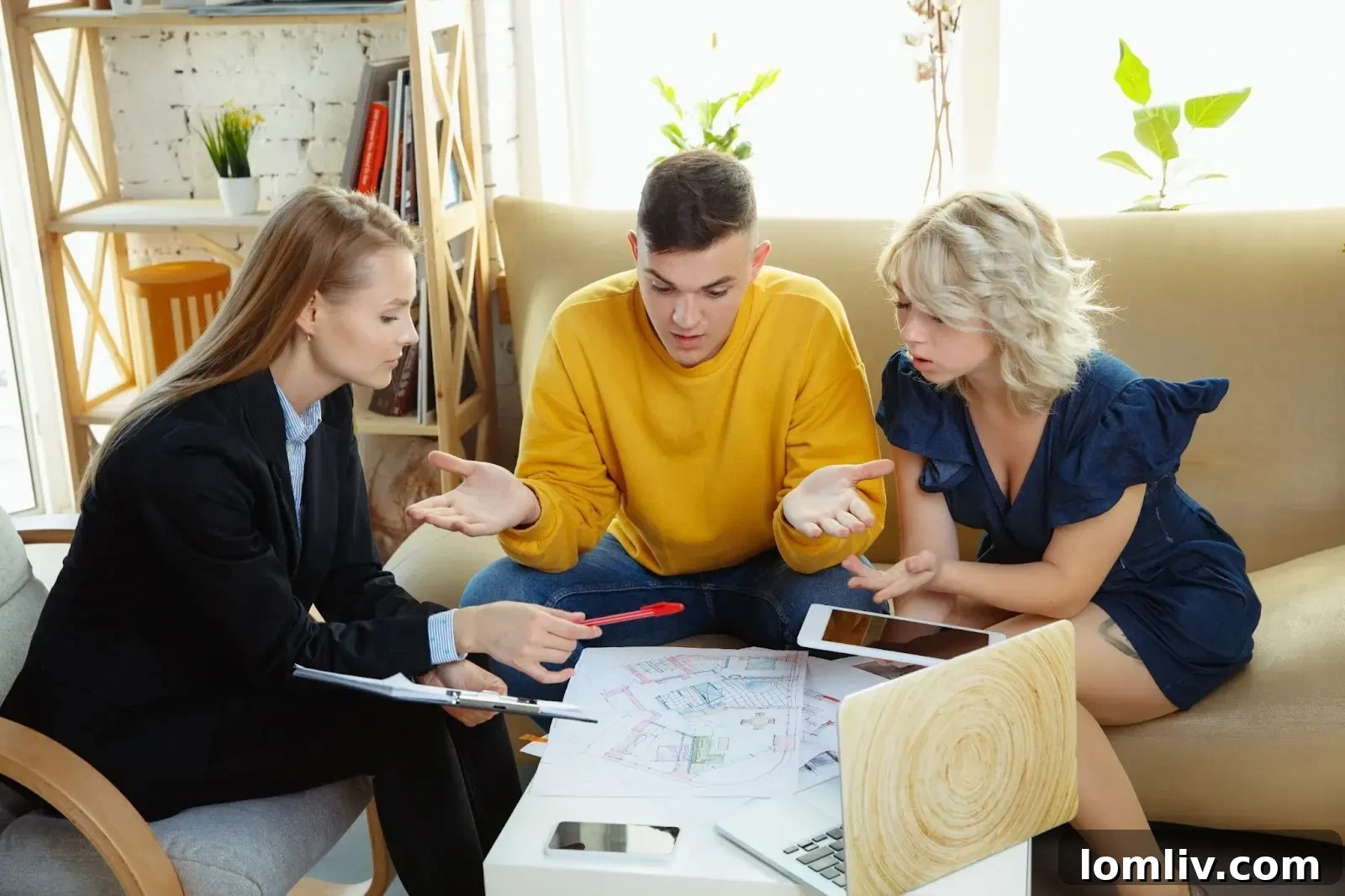 Property manager analyzing data on a laptop, optimizing short-term rental operations