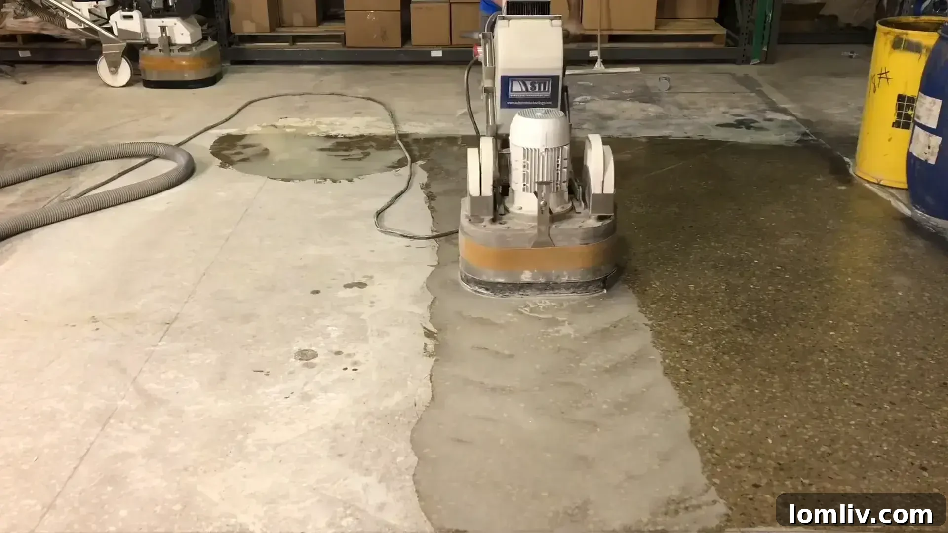Polished concrete floor in a modern kitchen, illustrating plan adaptability and seamless integration with other materials.