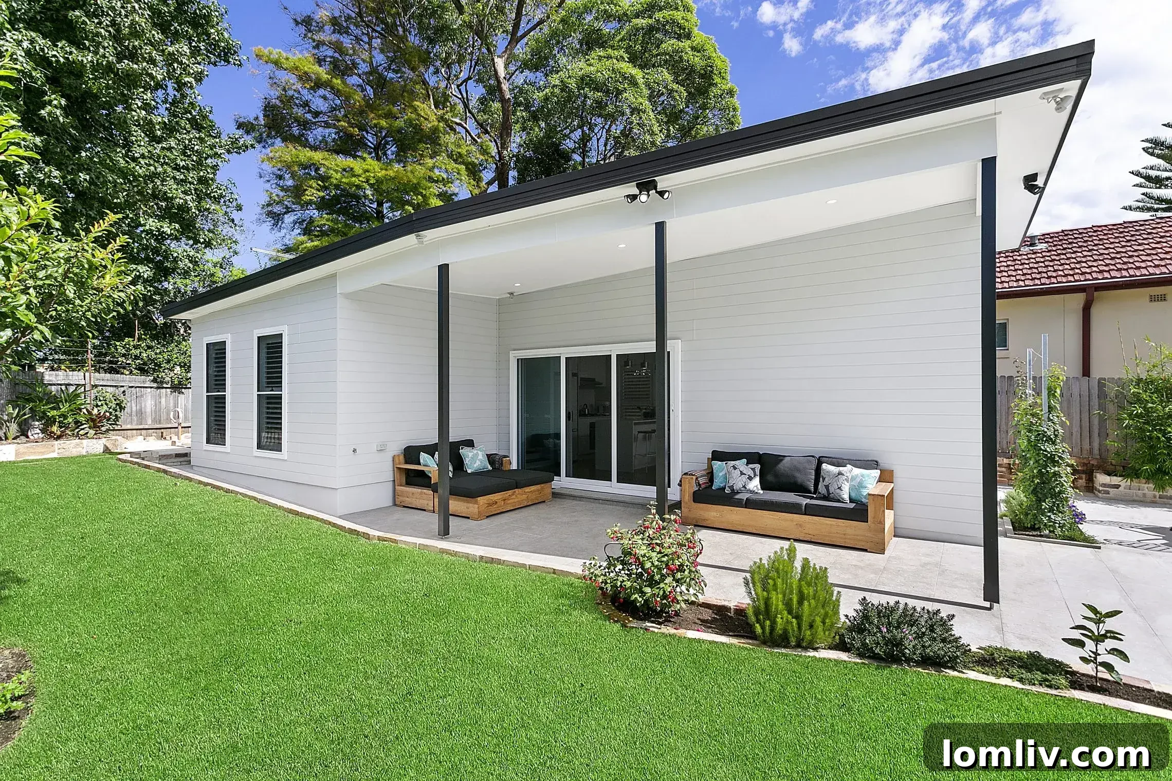 Tailoring Your Granny Flat Blueprint 2 Modern granny flat exterior with a spacious deck and clean lines, showcasing contemporary design principles.