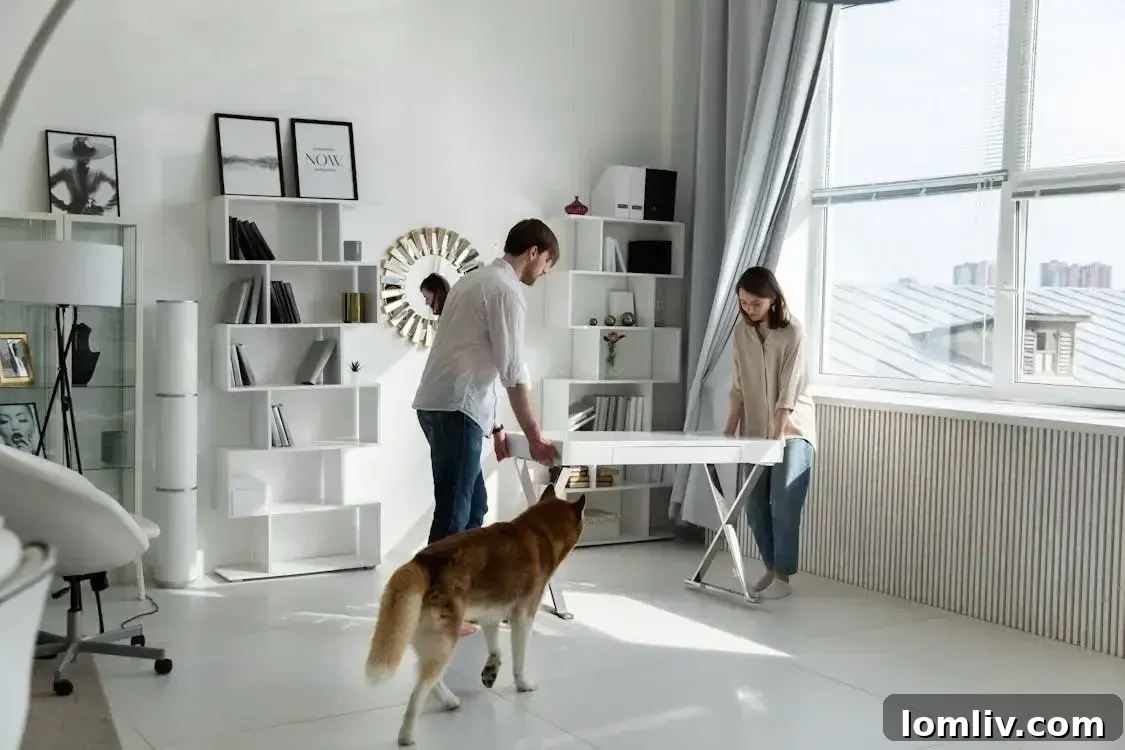 Your Home's Affordable Glow Up 10 Easy Steps 2 Couple moving a white desk in a refreshed home