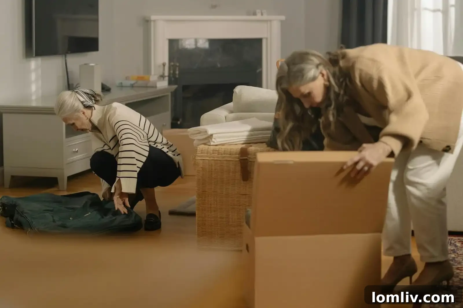 Beyond the Boxes: 8 Essential Tips for Settling into Southfield, Michigan 2 A person looking at moving boxes in a new, empty room, symbolizing the overwhelming yet exciting process of relocating to a new house.