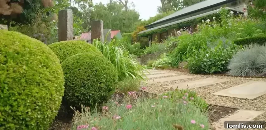 Lush green lawn with well-maintained flower beds and shrubs