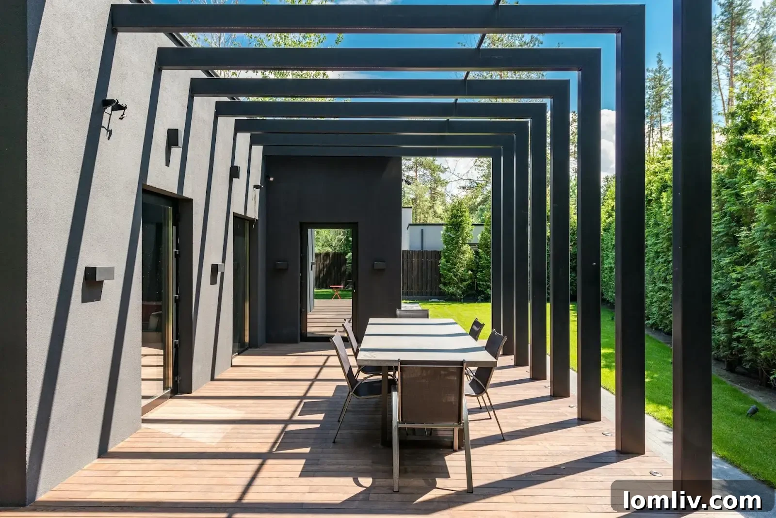 A beautifully landscaped backyard with a patio, garden, and seating area, suggesting an enhanced outdoor living space.