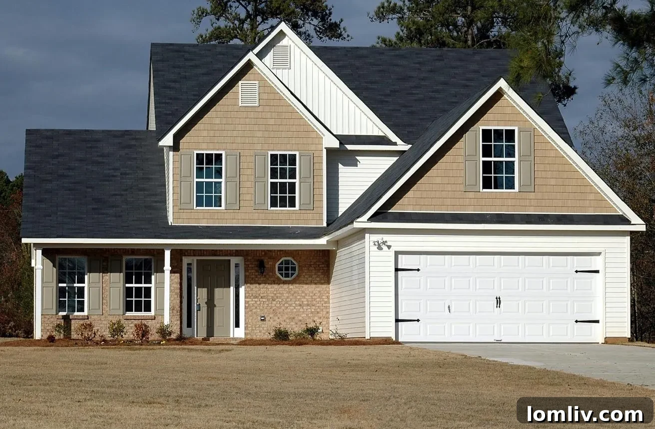 A person holding keys with a blurred background of a house, symbolizing the exciting moment of buying a first home.