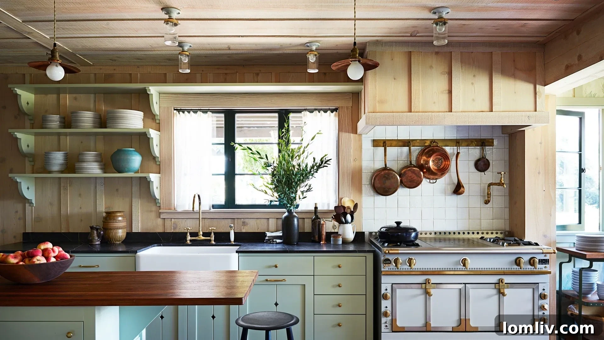 Close-up of Anne Hathaway's kitchen lighting, showing glass flush mounts and elegant copper pendants.