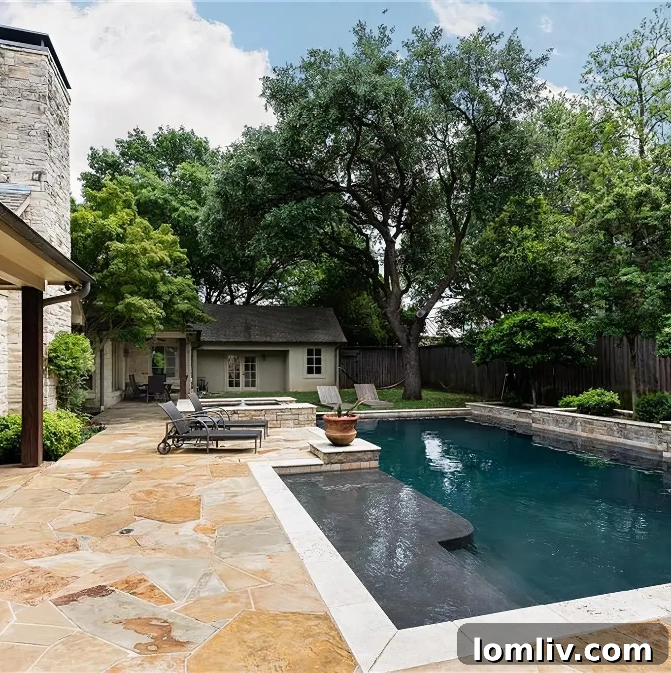 Scottie Scheffler's backyard with a rectangular pool and lush landscaping