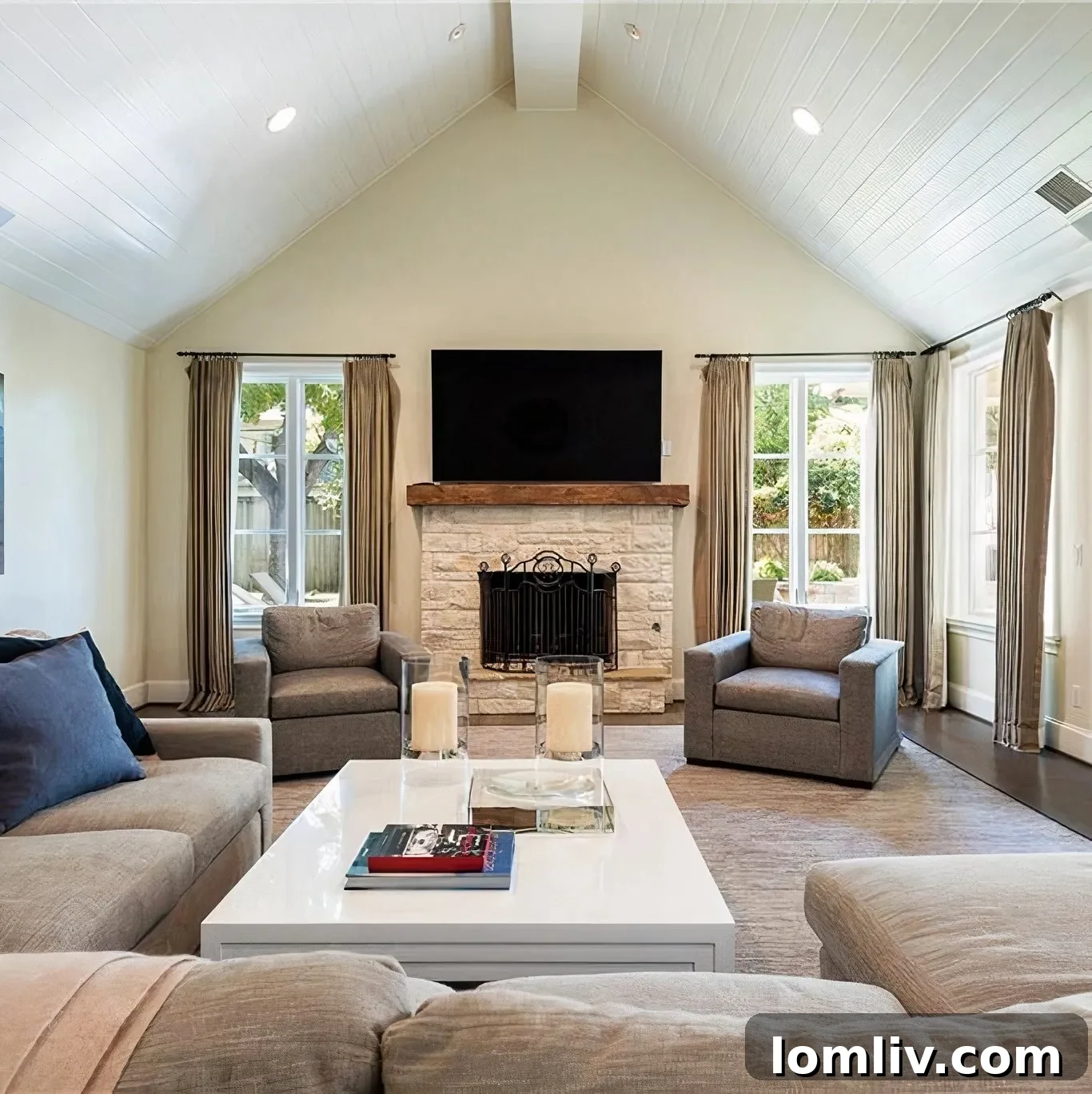 Scottie Scheffler's spacious living room with vaulted ceilings and a stone fireplace