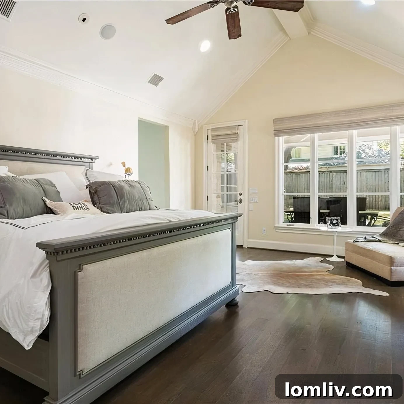 Scottie Scheffler's cozy master bedroom with a large window and peaceful view