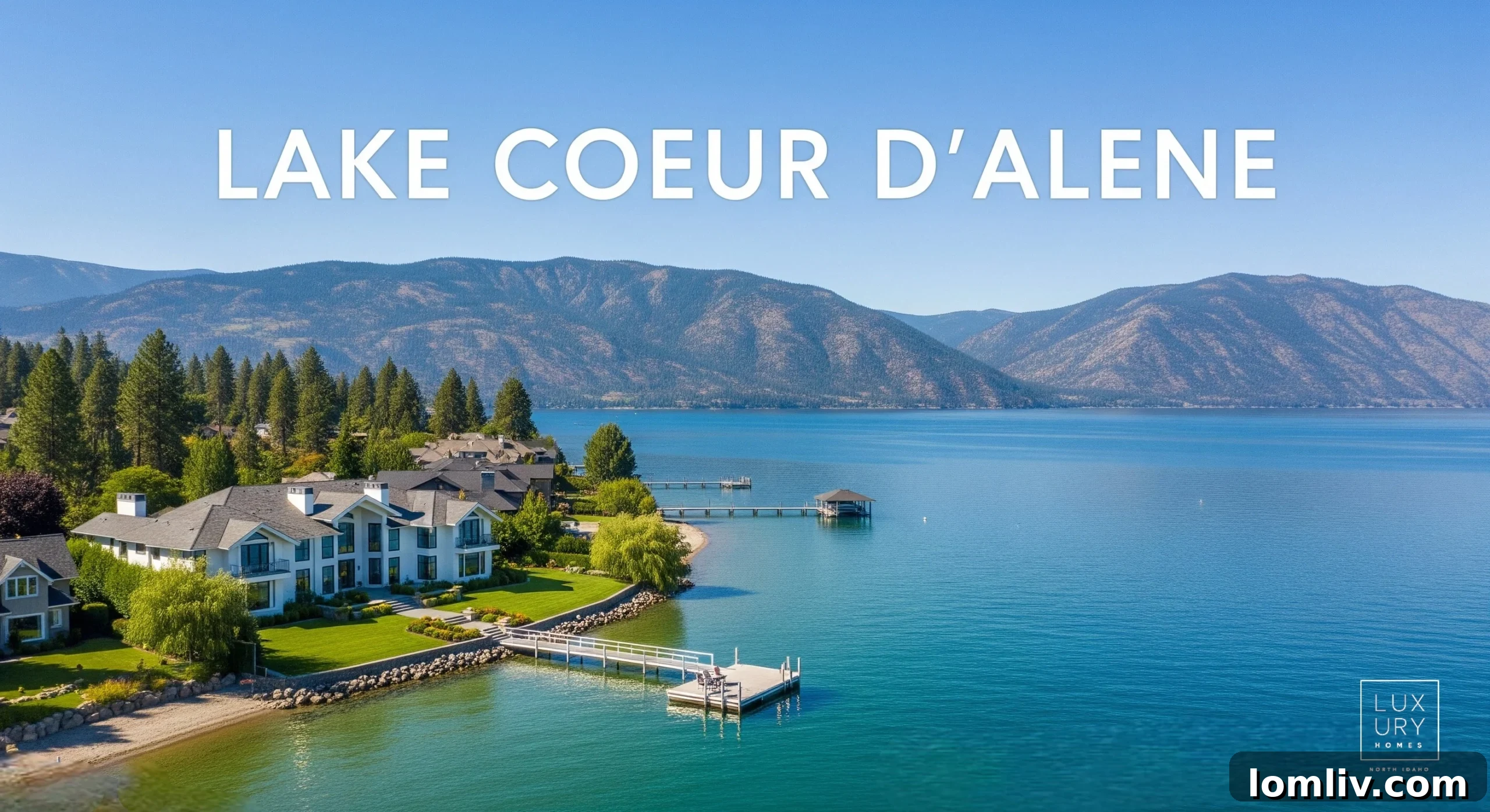 Dallas to North Idaho: Your Blueprint for Grand Living 2 Expansive view of a luxurious waterfront estate on Lake Coeur d'Alene with lush forests and mountains in the background, under a clear blue sky.