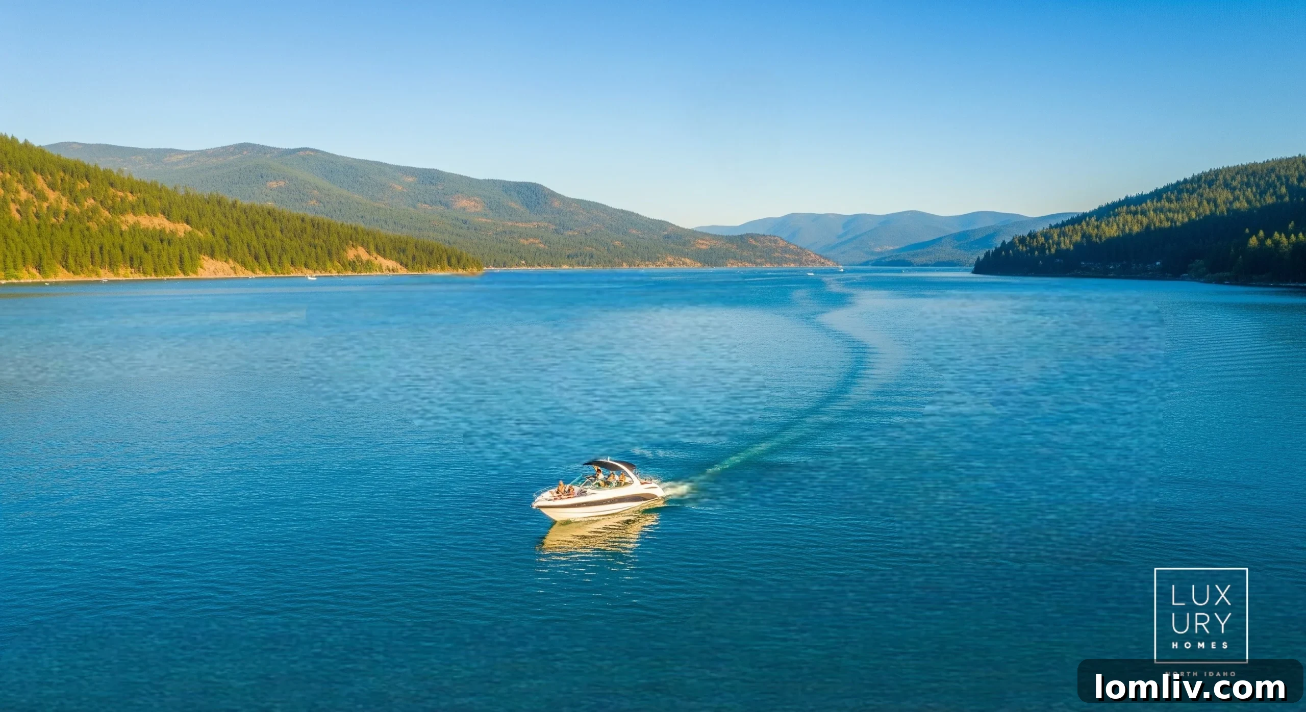 Dallas to North Idaho: Your Blueprint for Grand Living 7 A family enjoying watersports on a calm lake, surrounded by mountains, illustrating the active outdoor lifestyle of North Idaho.