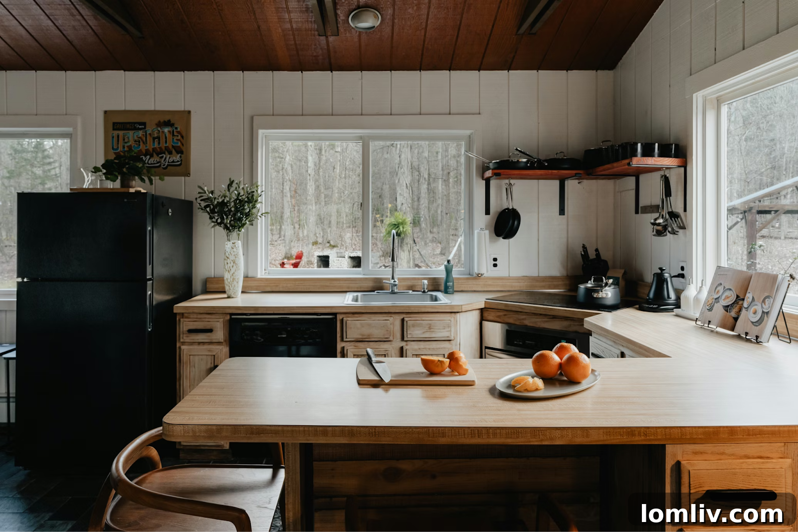 Kiwi Living: Crafting Homes That Blend Style, Comfort, and Function 2 Modern kitchen with wooden accents and ample counter space
